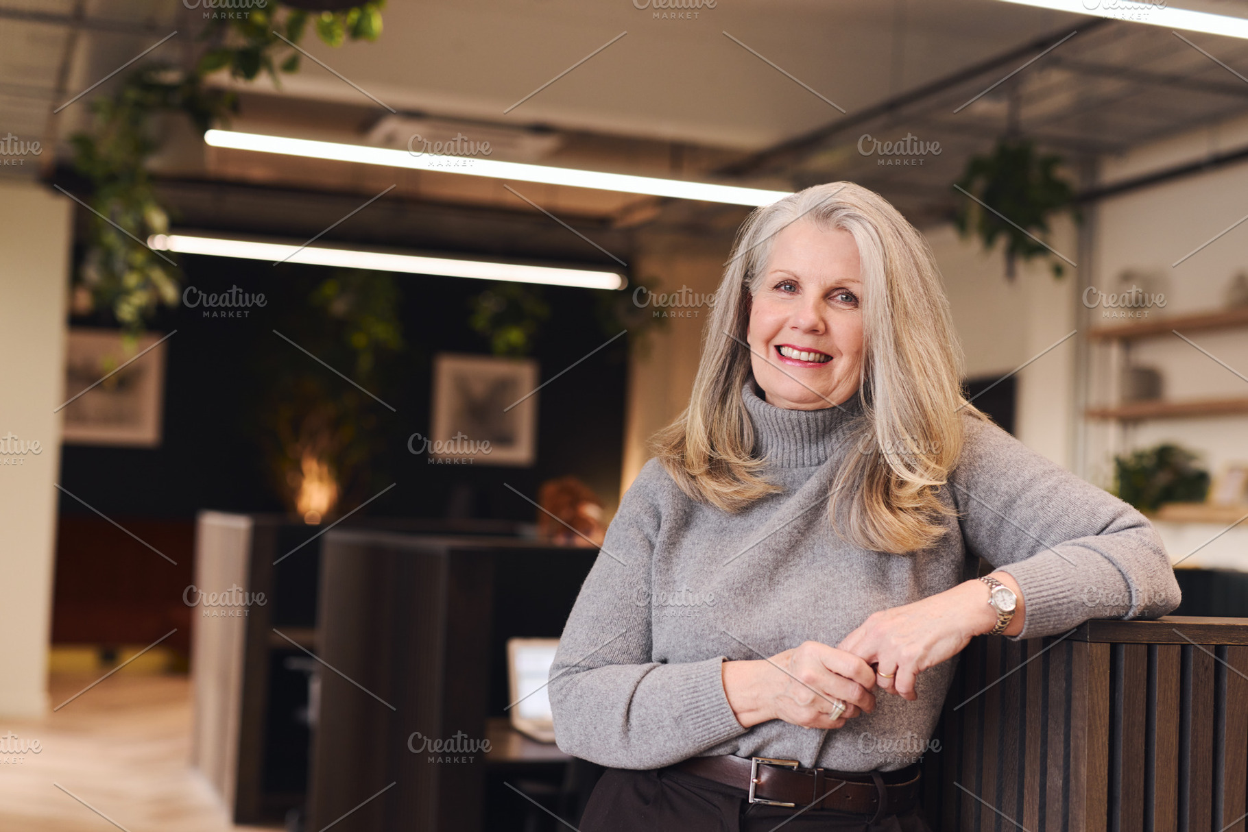 Portrait of confident senior white woman with long grey hair smiling and lookin, a Technology Photo by Southworks