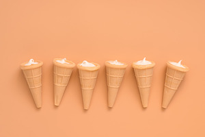 Waffle cones with delicate cream in
