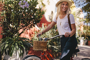 Beautiful woman riding her bike, a Person Photo by Jacob Lund