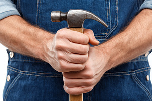 Man in denim overalls firmly grips, a Person Photo by MistyDay