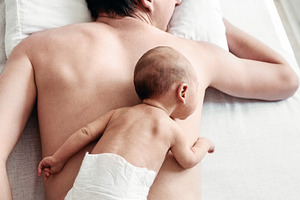 a newborn boy lies on his father, a Person Photo by Eni_fly