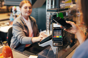 Unrecognizable woman paying by phone, a Person Photo by Artem Varnitsin