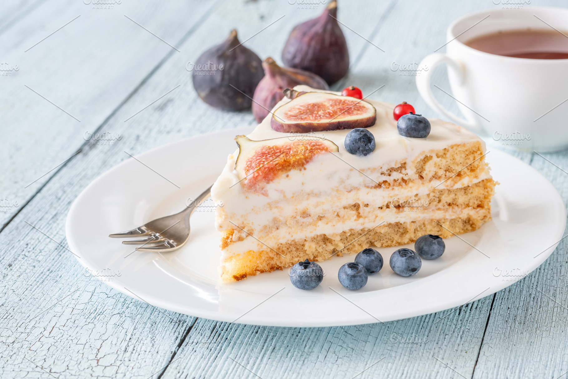 Cake wedge topped berries, a Food & Drink Photo by Alexander Prokopenko