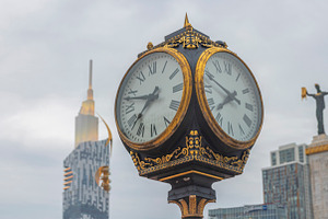 Vintage street clock close up at Europe Square with Medea statue, a Photo by Pictures for you!!!!!!!!!