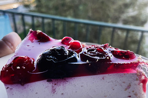 Delicious berry cheesecake slice captured during a calm evening outdoors, a Photo by AS photostudio