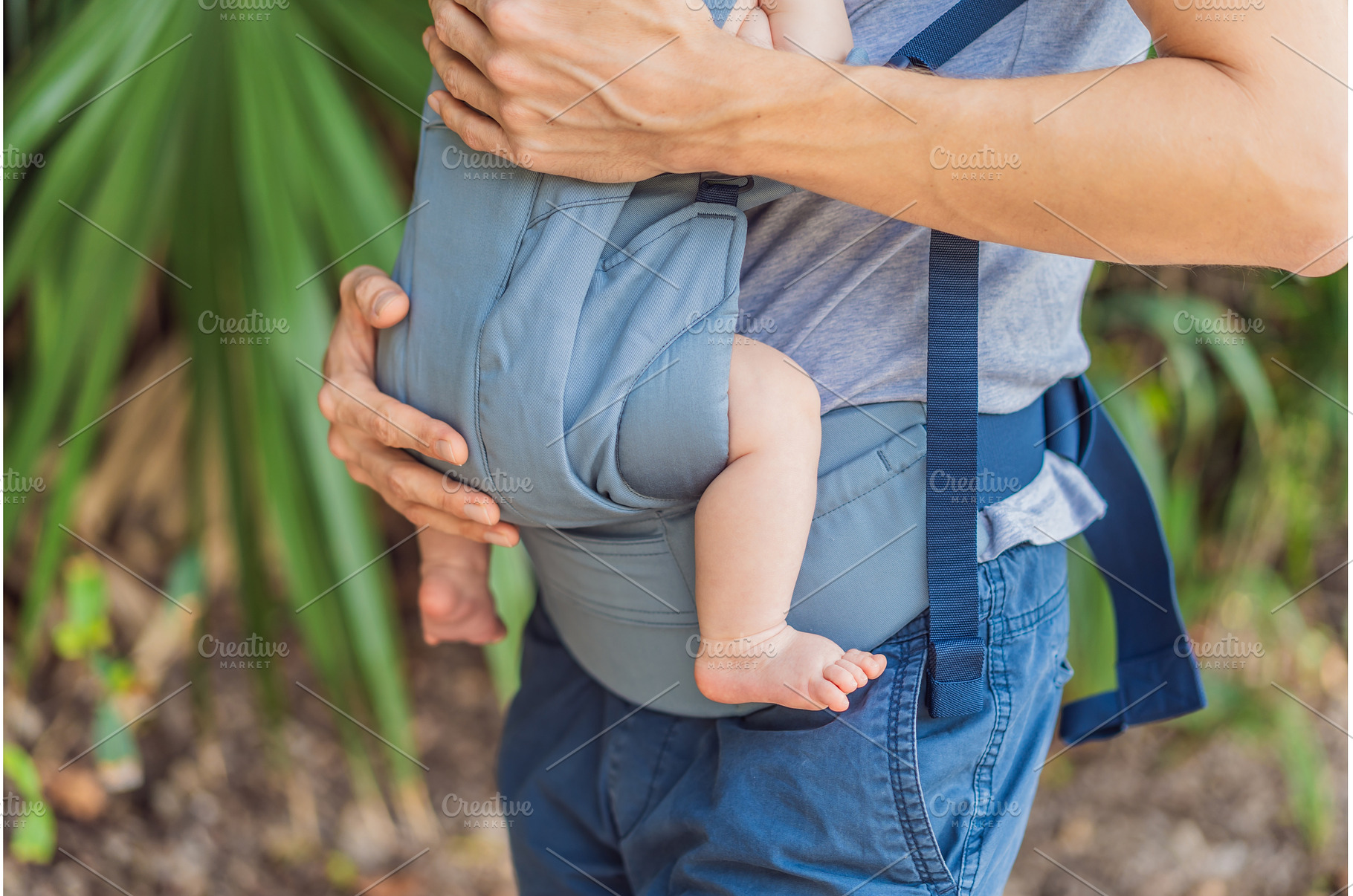 Young father walks in nature with, a Person Photo by Elizaveta Galitskaya