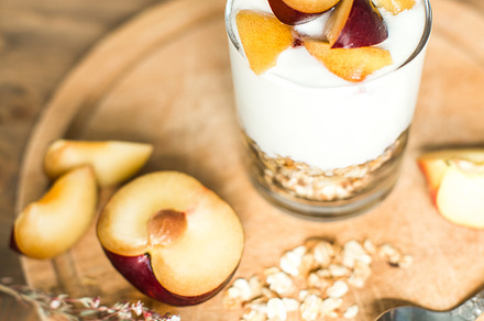 Granola with yogurt and plum stock photo containing parfait and dessert, a Food & Drink Photo by yuliasverdlova