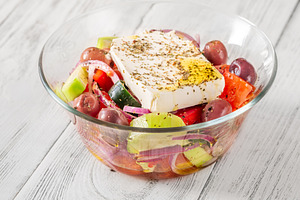 Fresh traditional Greek salad, a Food & Drink Photo by Alexander Prokopenko