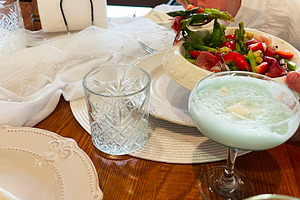 Elegant table setting with fresh salad and refreshing drinks for a pleasant mea, a Photo by AS photostudio