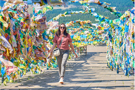 A girl walks under an arch with