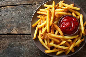 Freshly made American French fries, a Photo by Pavel_design
