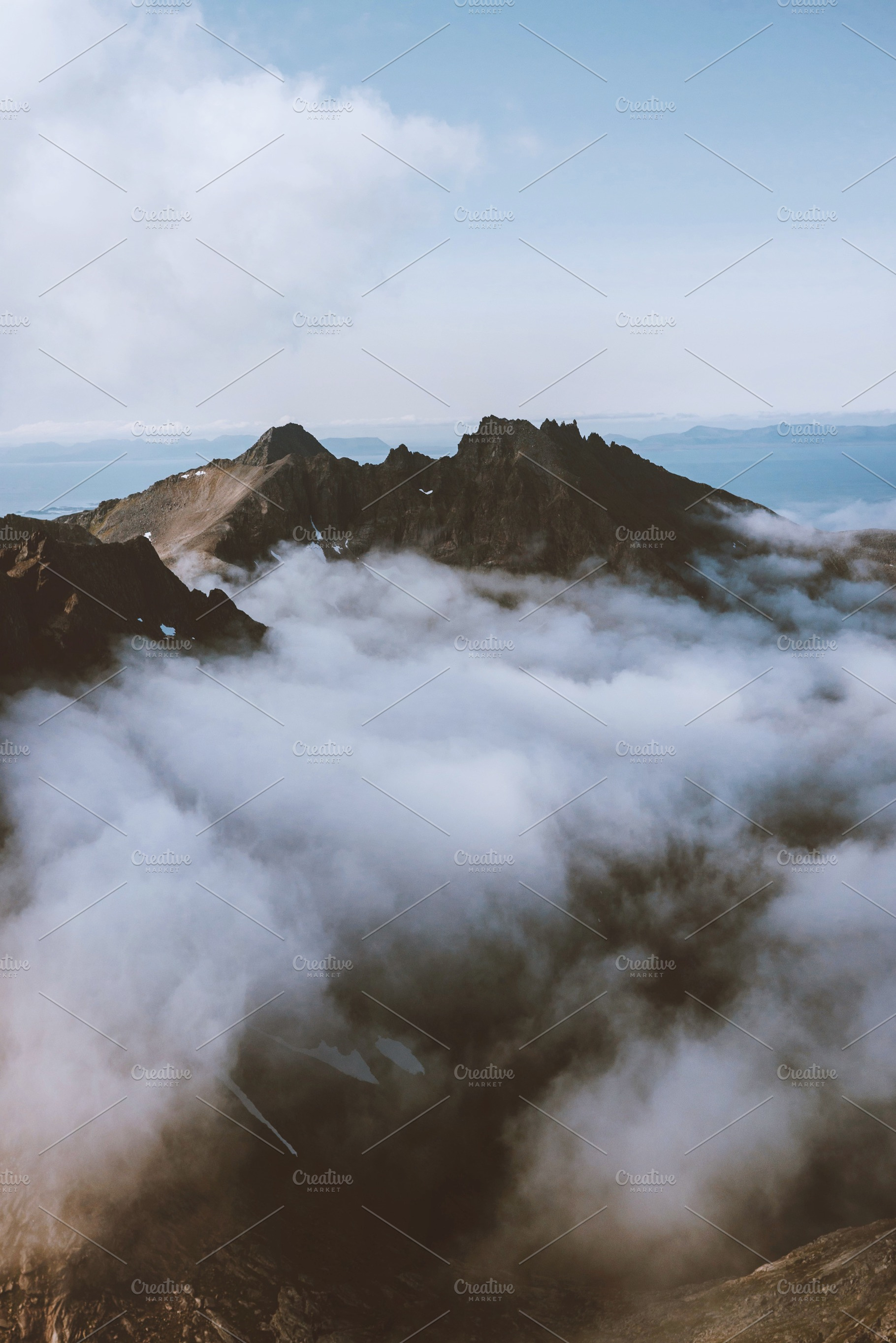 Aerial mountain peak view above clou, a Nature Photo by e v e r s t