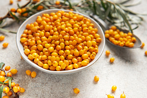 Sea buckthorn berries in bowl healthy eating concept, a Food & Drink Photo by Olena Rudo