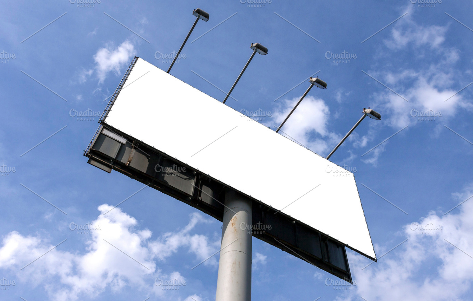 Outdoor billboard against blue sky, an Industrial Photo by BOOCYS