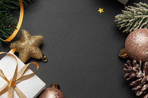 Christmas gifts and decorations forming dark background frame, a Holiday Photo by Olena Rudo