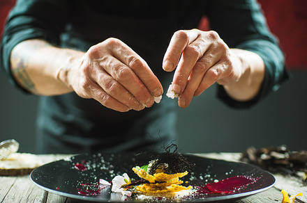 Closeup of male hands preparing molecular dish stock photo containing food