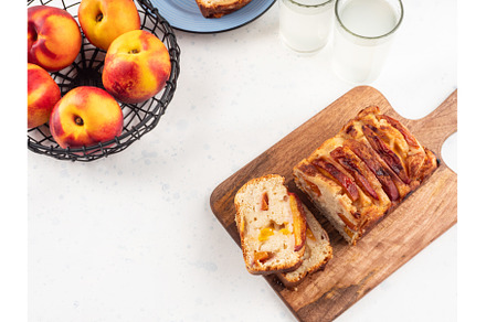 Peach cake loaf on wooden cutting