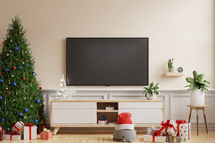 Christmas room with TV cabinet in modern living room on cream wall background.
