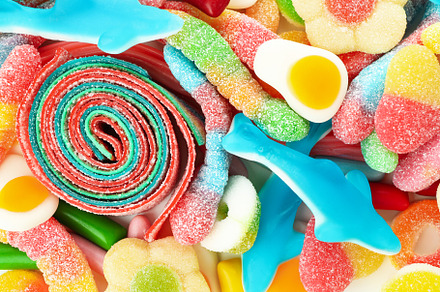Gummy candies all over background, close up, a Food & Drink Photo by AtlasStudio PRO