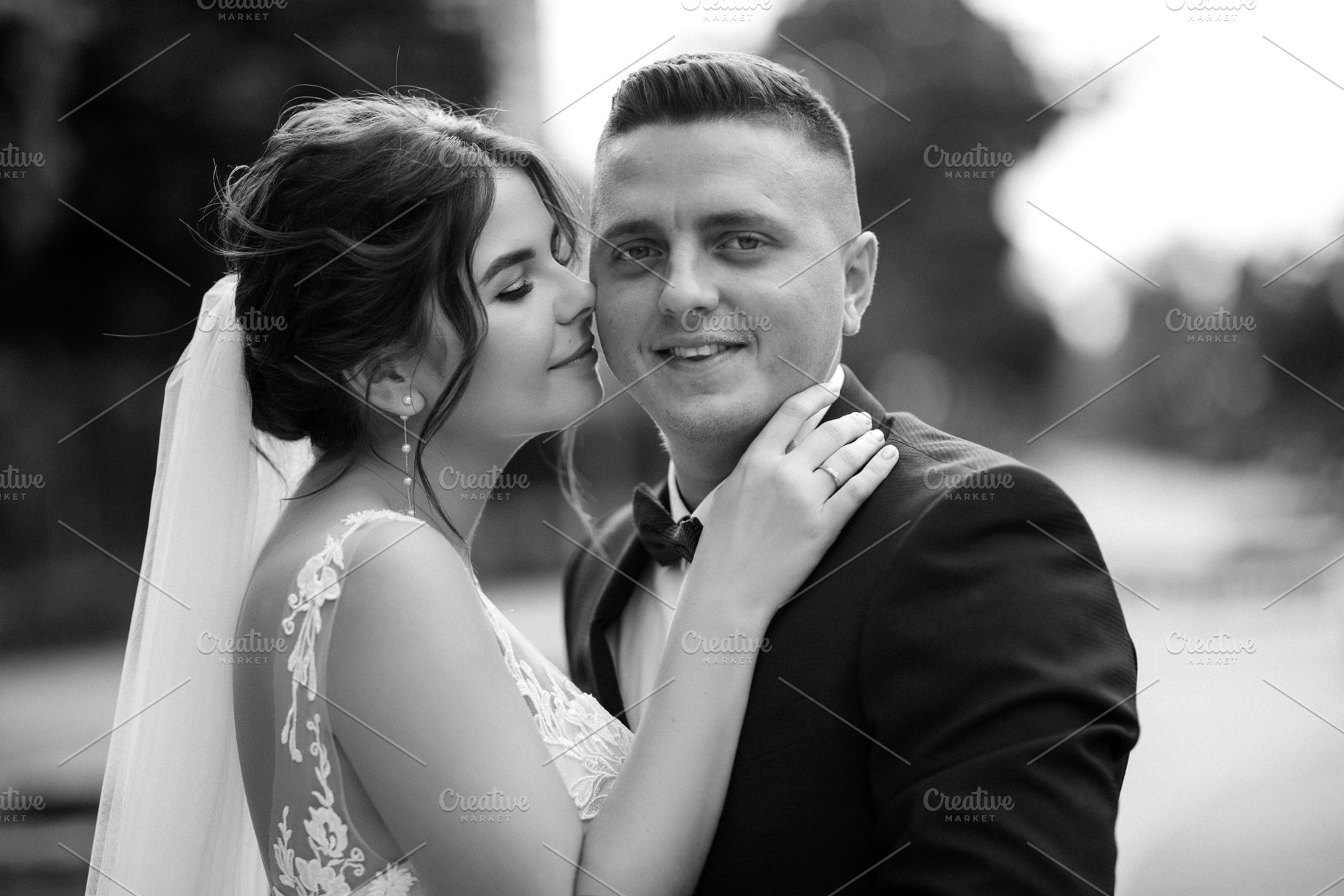 the groom in a brown suit and the bride in a white dress, a Person Photo by Weddings, People, Travel