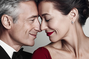 Loving middle aged couple touching foreheads, celebrating romanc, a Photo by Studio ANNA