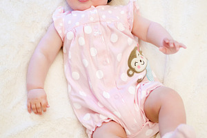 Baby girl lying on her back containing adorable, baby, and beautiful