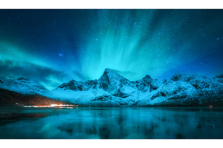 Northern lights over snowy mountains, a Nature Photo by den-belitsky