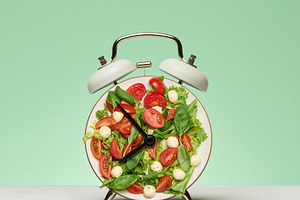 The white alarm clock dial is replaced by a fresh salad of cherr, a Food & Drink Photo by ndanko