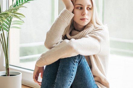 Sad girl near window thinking about something, a Person Photo by Olena Rudo