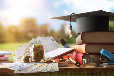 Education cost with books and money outside and educational buil