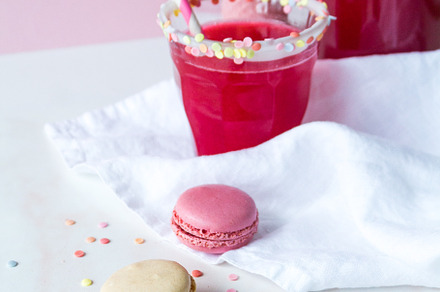 Colorful macarons and red drink