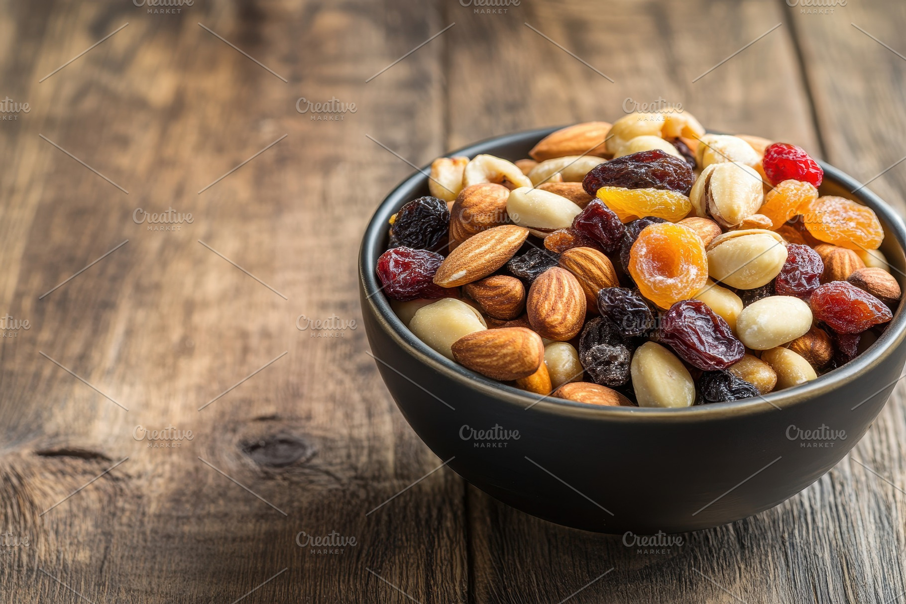 Bowl filled with assorted mixed nuts, a Photo by Pavel_design