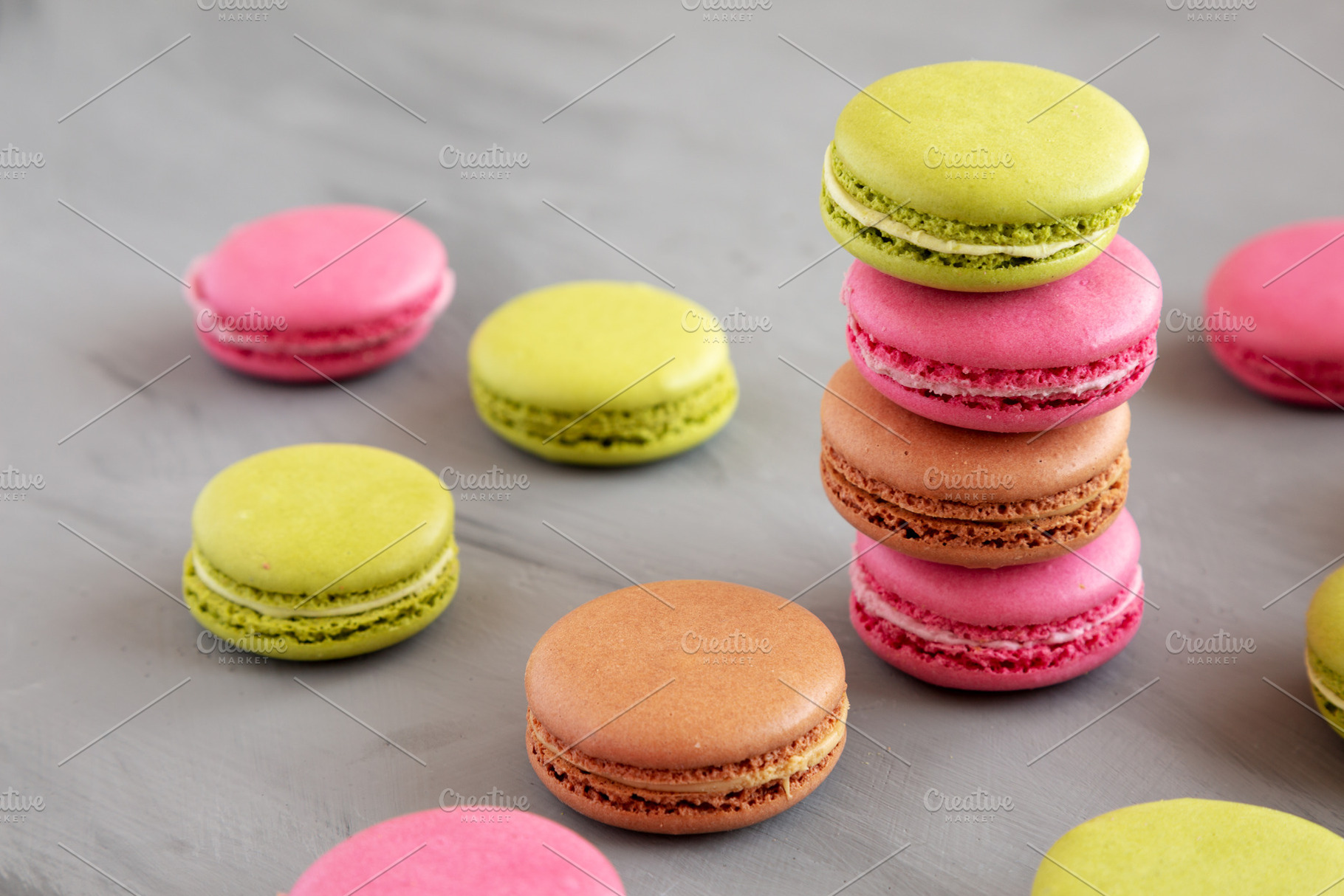 Colorful Homemade French Macarons on gray background, side view., a Food & Drink Photo by LiudmylaChuhunova