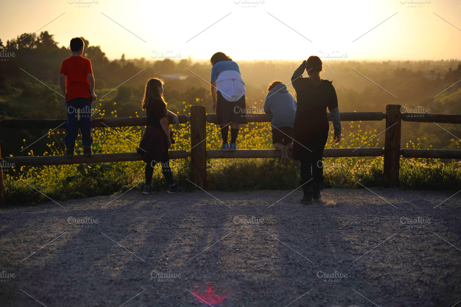 Kids looking at golden sunset, a Person Photo by Serifs & Whiskey