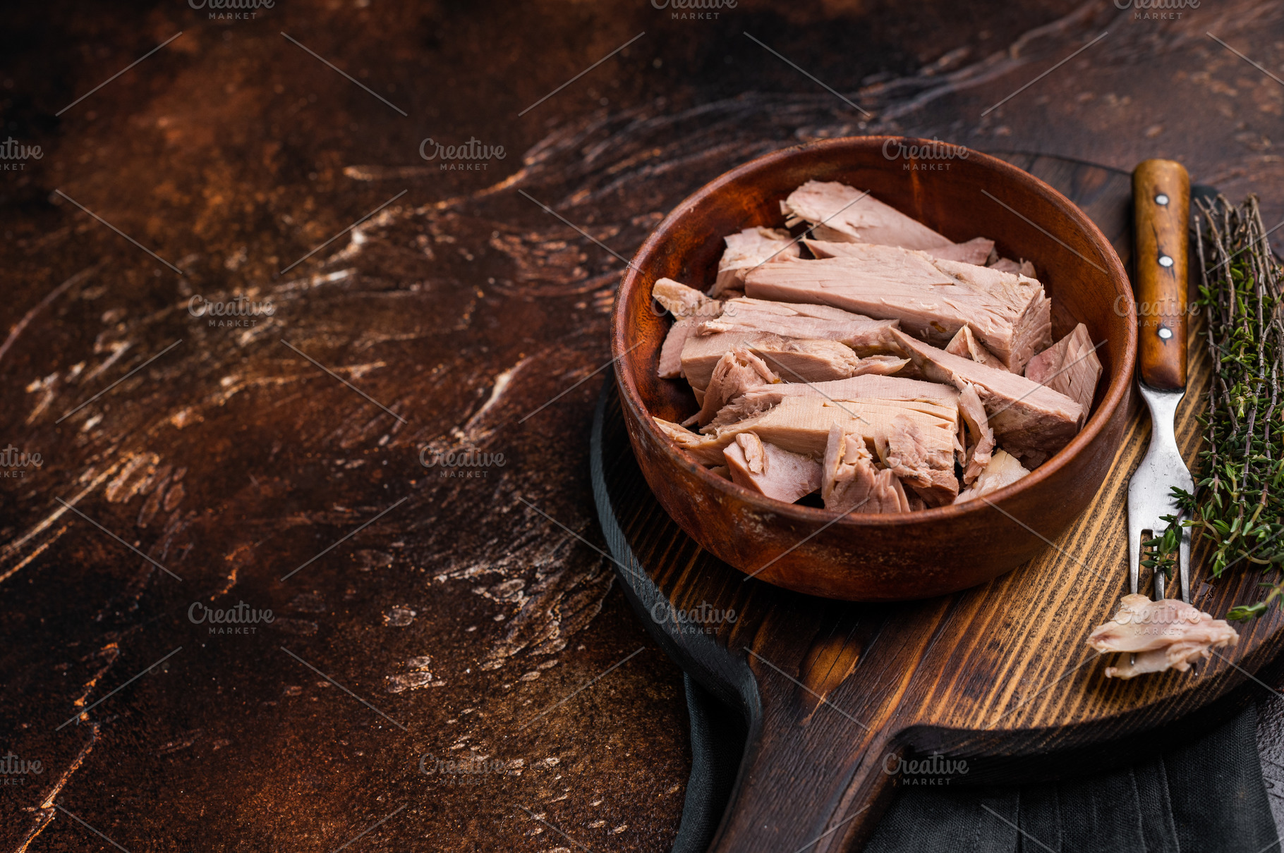 Sustainable tinned tuna fillet in a wooden bowl, promoting eco f, a Food & Drink Photo by composter-box@mail.ru