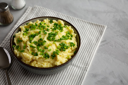 Homemade Mashed Potatoes with Chives in a Bowl, side view. Copy, a Food & Drink Photo by LiudmylaChuhunova