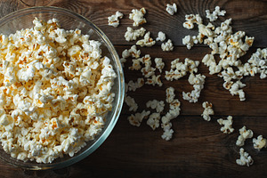 Popcorn on wood color background.Food and snack concepts ideas.Minimal style to, a Food & Drink Photo by Budarinphoto
