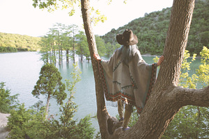 Young woman in poncho featuring boho, fashion, and women