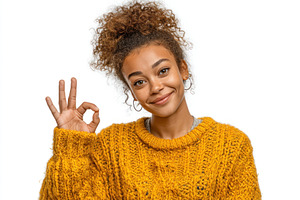 Smiling young woman with curly hair in yellow knit sweater makin, a Person Photo by José Manuel Gelpi