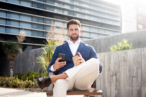 Businessman using smartphone during coffee break, a Business Photo by etorres69