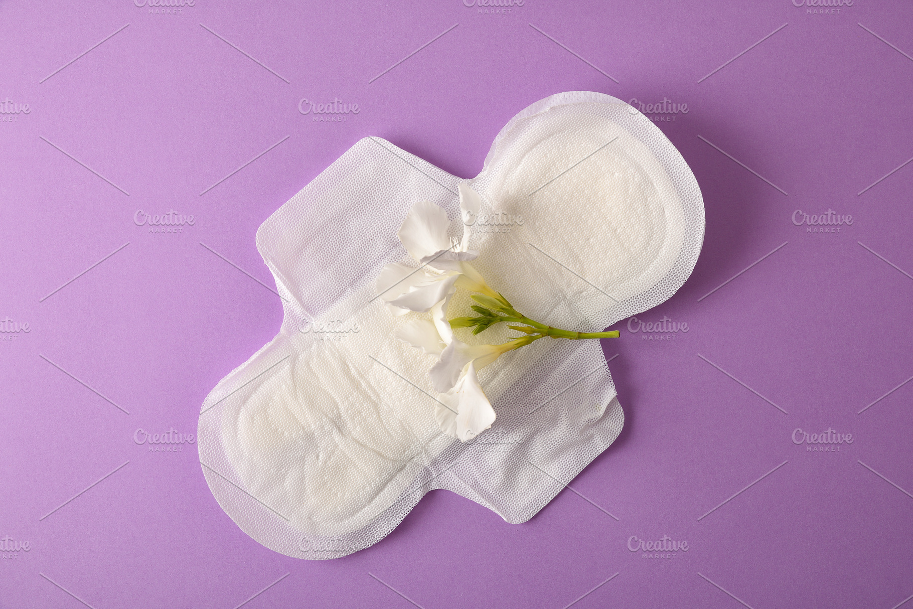 Absorbent protective pad for women care on lilac background, a Health & Medical Photo by Davizro's Market