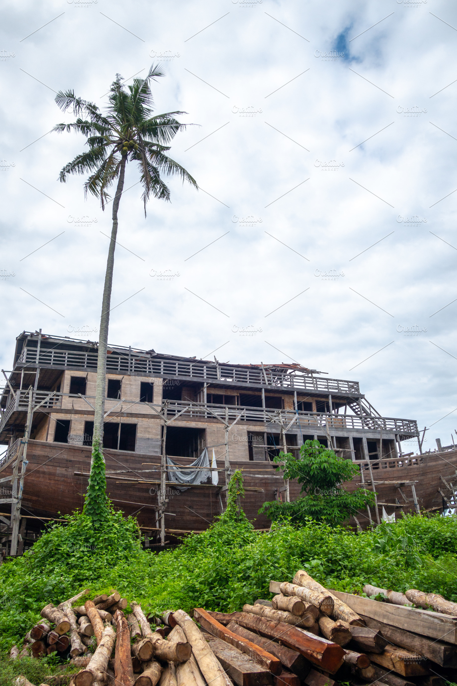 Traditional wooden boat under construction in Tana Beru, Indones, a Nature Photo by GoodGoods