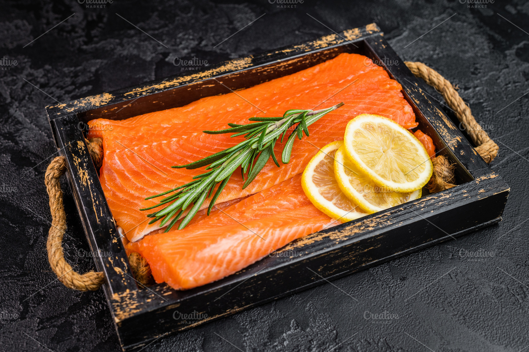 Uncooked salmon fillet with bright orange flesh rosemary and lem, a Food & Drink Photo by composter-box@mail.ru