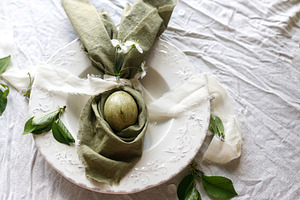 Happy Easter! Stylish dyed egg in bunny ears napkin and spring f, a Holiday Photo by Sonjachni
