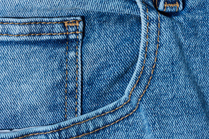 Close up of blue denim jeans showing a front pocket corner with, a Background Photo by ndanko
