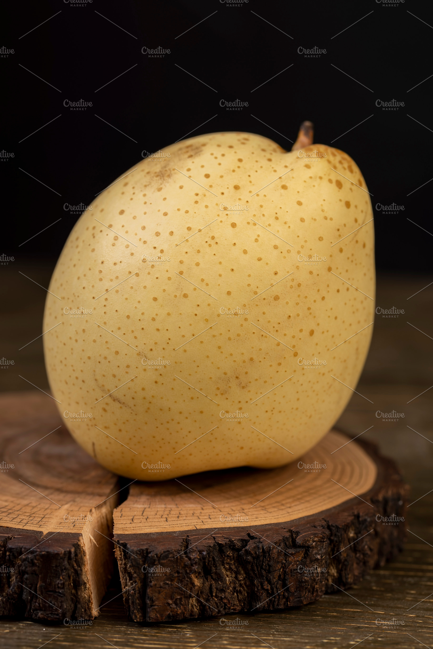 one white pear on the table, sweet fresh white pear, a Photo by rsoollAI