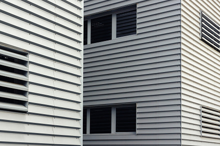 Close-up of a modern building facade, an Architecture Photo by Geasuha