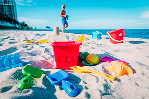 Kid building castle on beach featuring activity, beach, and build