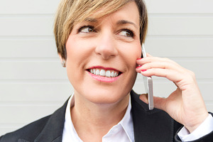 Businesswoman talking on phone close up portrait, a Photo by RF Images