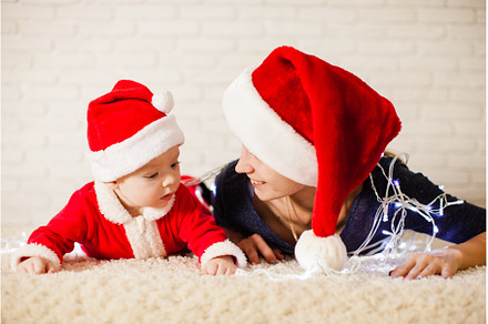 Mom with baby in santa claus costume, a Holiday Photo by oksix